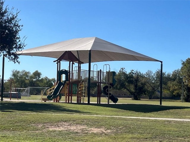 community jungle gym with a lawn