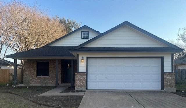 single story home with brick siding, fence, and an attached garage