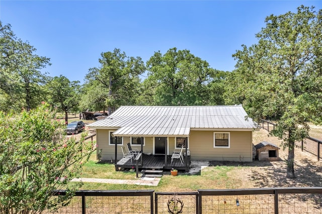 view of front of home featuring a wooden deck