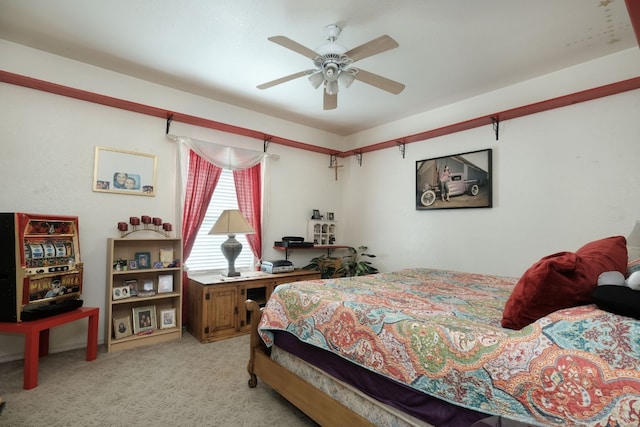 bedroom with ceiling fan and light carpet