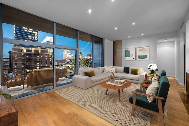 living room featuring hardwood / wood-style flooring and floor to ceiling windows