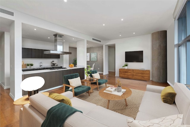 living room with light hardwood / wood-style floors