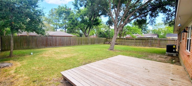 exterior space featuring central AC and a yard