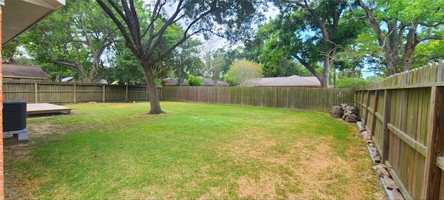 view of yard featuring central AC unit