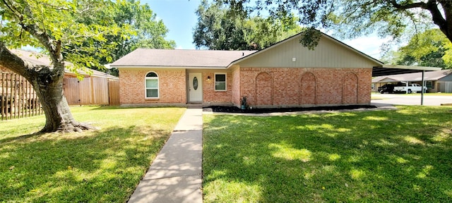 view of front facade with a front lawn and a carport