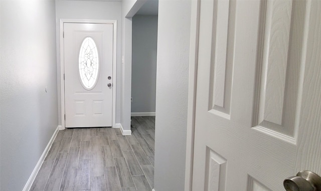 foyer with light hardwood / wood-style floors