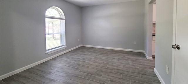 unfurnished room featuring hardwood / wood-style floors