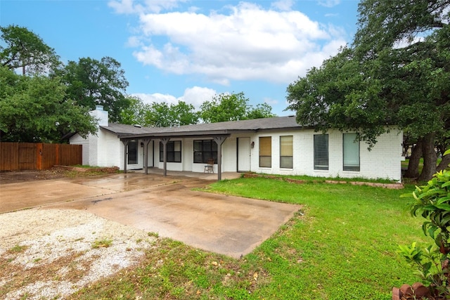 rear view of house with a yard