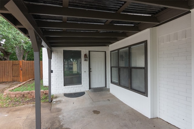 doorway to property with a patio