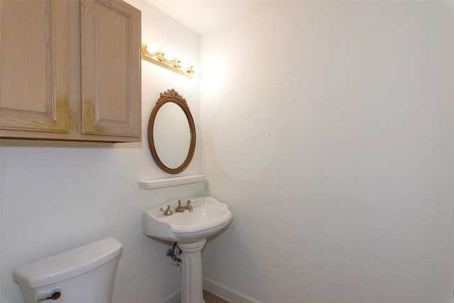 bathroom featuring toilet