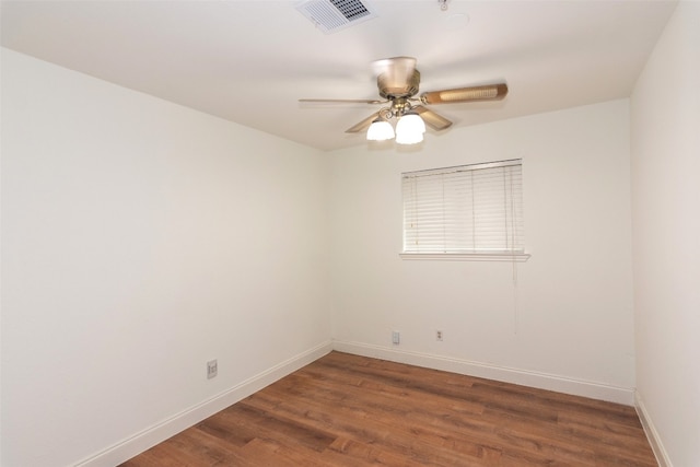 unfurnished room featuring dark hardwood / wood-style flooring and ceiling fan