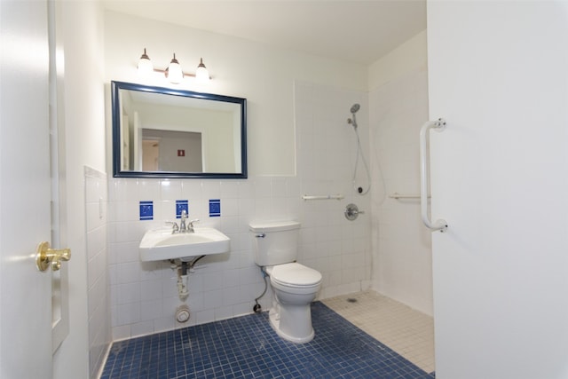 bathroom featuring tile walls, tile floors, toilet, and a tile shower