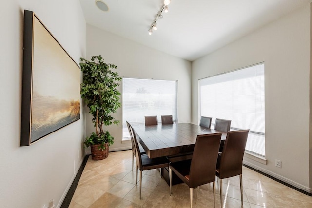 tiled dining area with track lighting