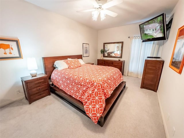 bedroom featuring ceiling fan and light colored carpet