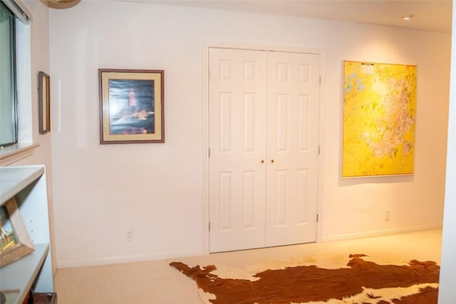 unfurnished bedroom with carpet flooring and a closet