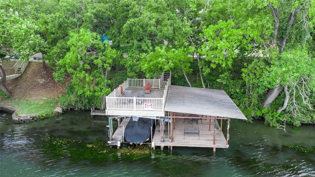 dock area featuring a deck with water view