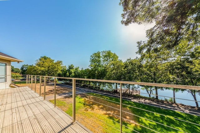 wooden deck featuring a water view