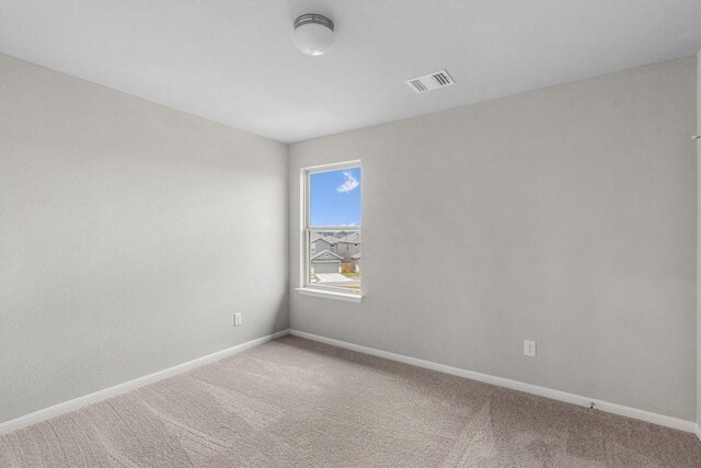 spare room featuring carpet floors