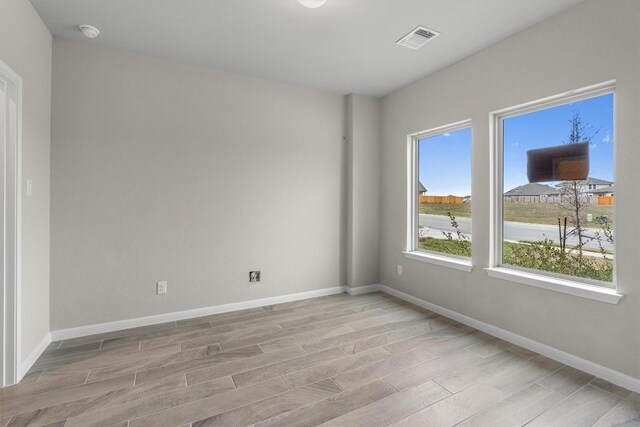 empty room with light wood-type flooring