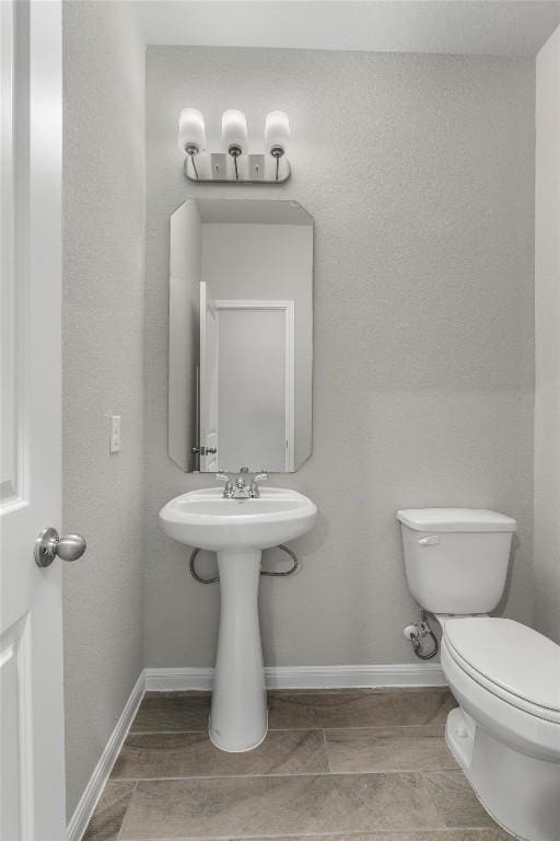 bathroom featuring toilet