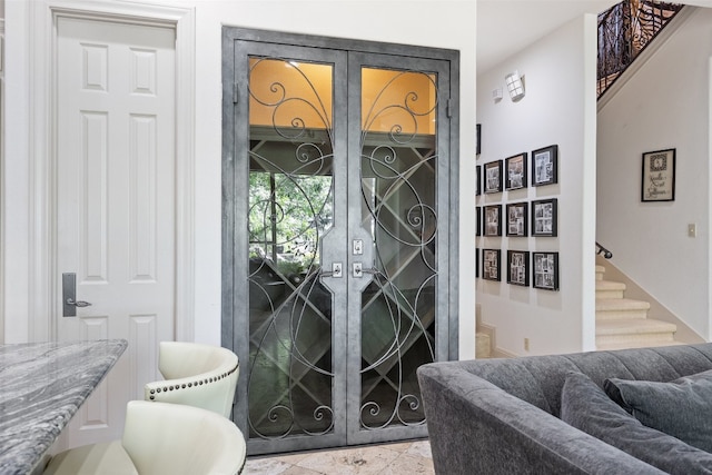 doorway to outside with french doors and light tile floors