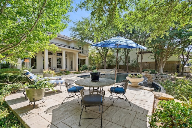 view of patio featuring a fenced in pool