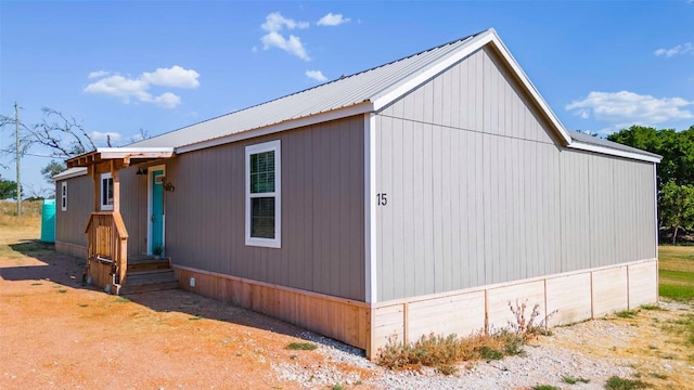 95 Loma Ln, Fredericksburg, TX 78624 - view of side of home featuring metal roof and a detached garage