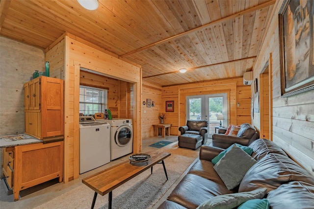 living room featuring wood ceiling, washing machine and dryer, wooden walls, and french doors