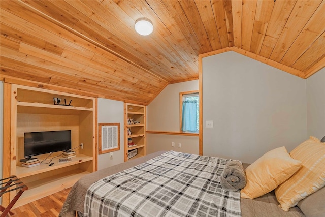 bedroom featuring light wood-type flooring, wood ceiling, and vaulted ceiling