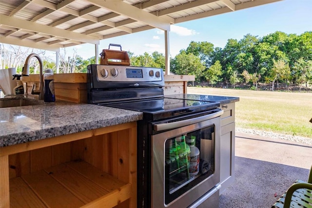 95 Loma Ln, Fredericksburg, TX 78624 - view of patio / terrace with a sink, exterior kitchen, and a carport