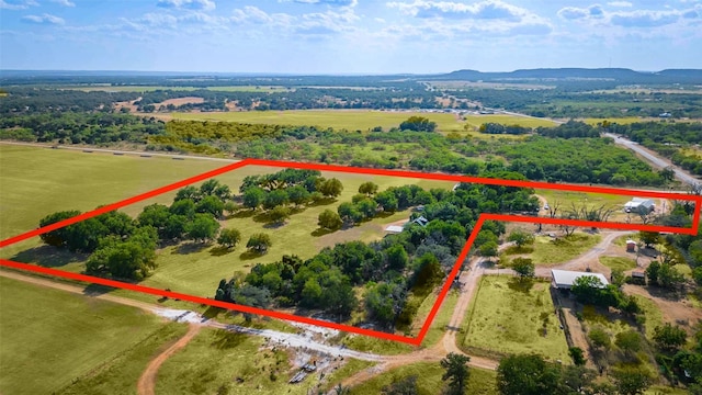 birds eye view of property with a rural view