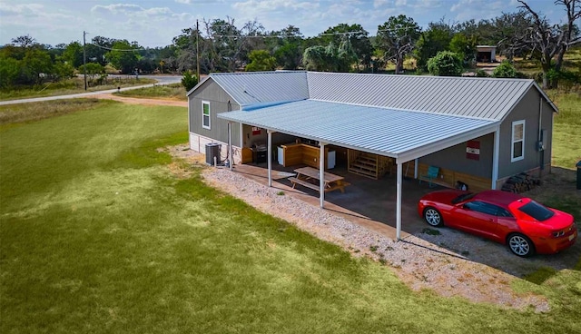 95 Loma Ln, Fredericksburg, TX 78624 - rear view of property with driveway, a carport, a yard, metal roof, and cooling unit