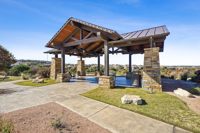 view of home's community featuring a gazebo, a yard, and a patio area