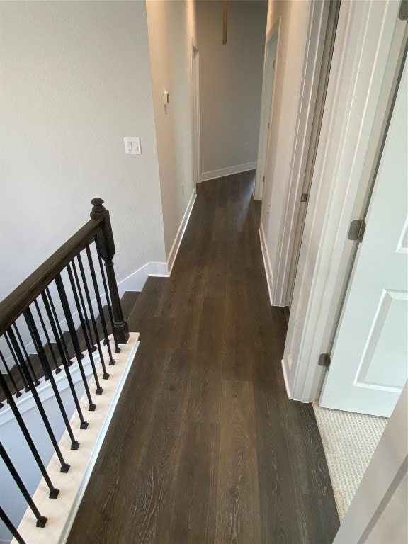 corridor featuring dark wood-type flooring