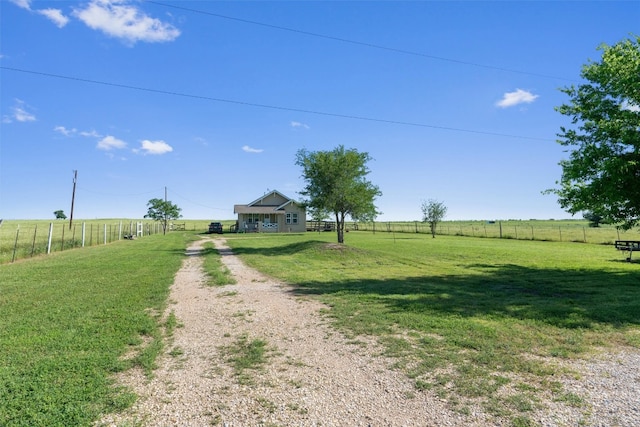 view of yard with a rural view