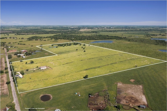 aerial view with a rural view and a water view