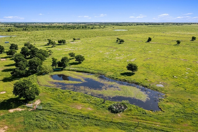 drone / aerial view with a rural view and a water view