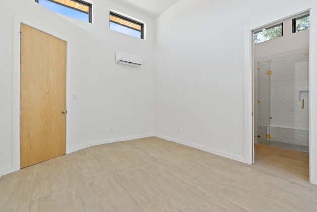 entrance foyer featuring plenty of natural light and a wall unit AC