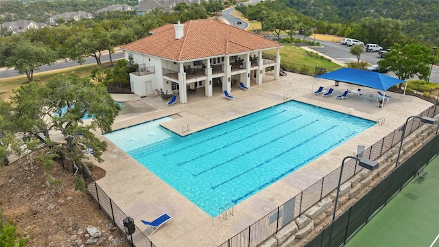 view of pool featuring a bar and a patio area