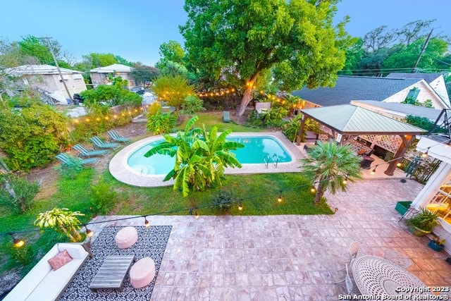 view of pool with a patio area, a hot tub, and a gazebo