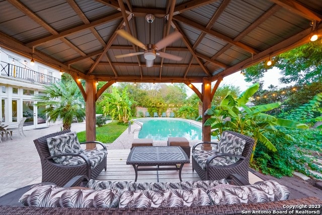 view of patio featuring outdoor lounge area, a gazebo, and ceiling fan