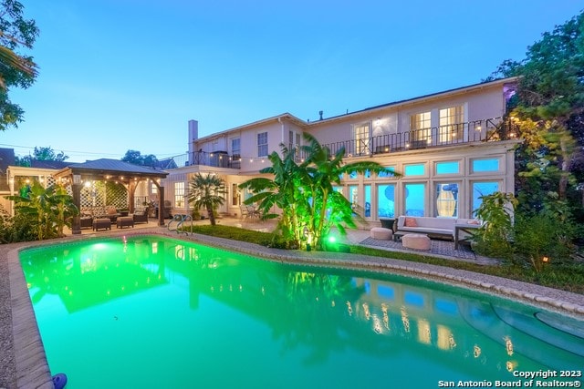 view of pool featuring an outdoor hangout area and a patio