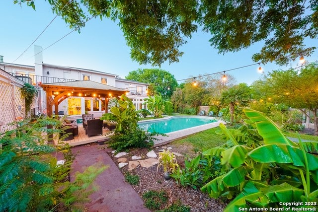 view of pool featuring a gazebo and a wooden deck