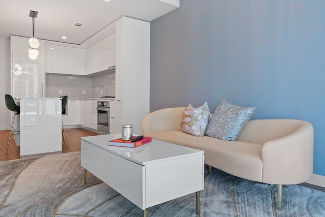 living room with light hardwood / wood-style flooring