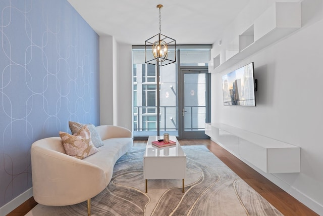 interior space with french doors, a chandelier, and hardwood / wood-style floors