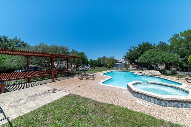 view of pool with a hot tub and a patio area