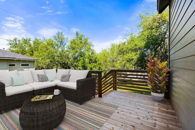 wooden terrace with an outdoor hangout area