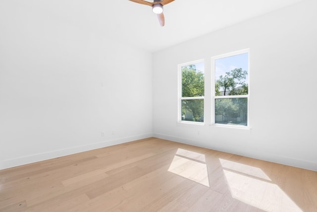 empty room with light wood-type flooring and ceiling fan