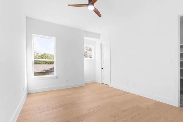 spare room with light hardwood / wood-style floors and ceiling fan