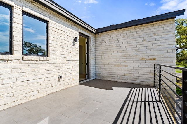 doorway to property featuring a balcony